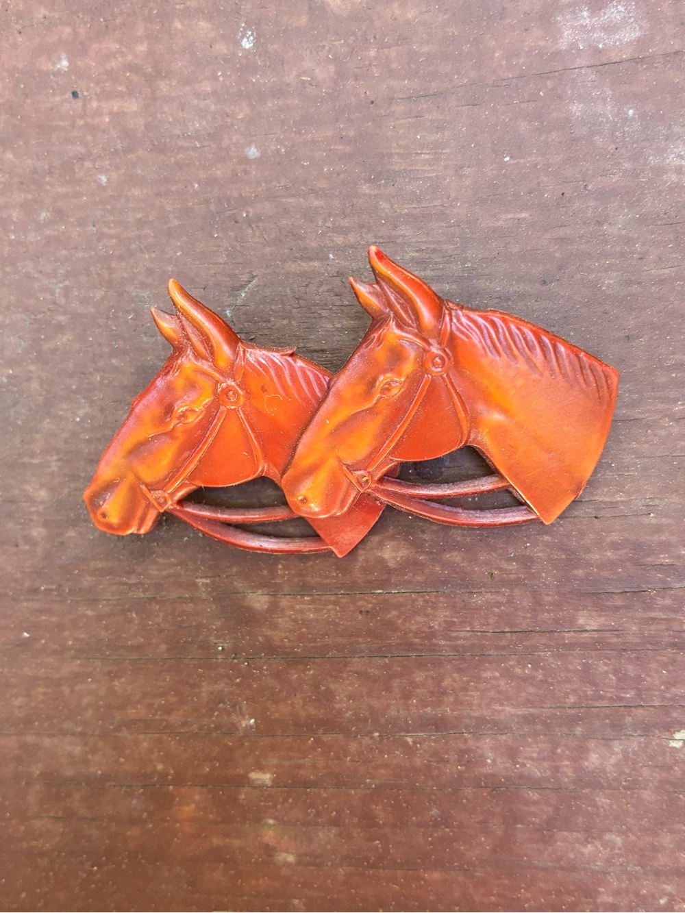 Two horse head pin made of celluloid